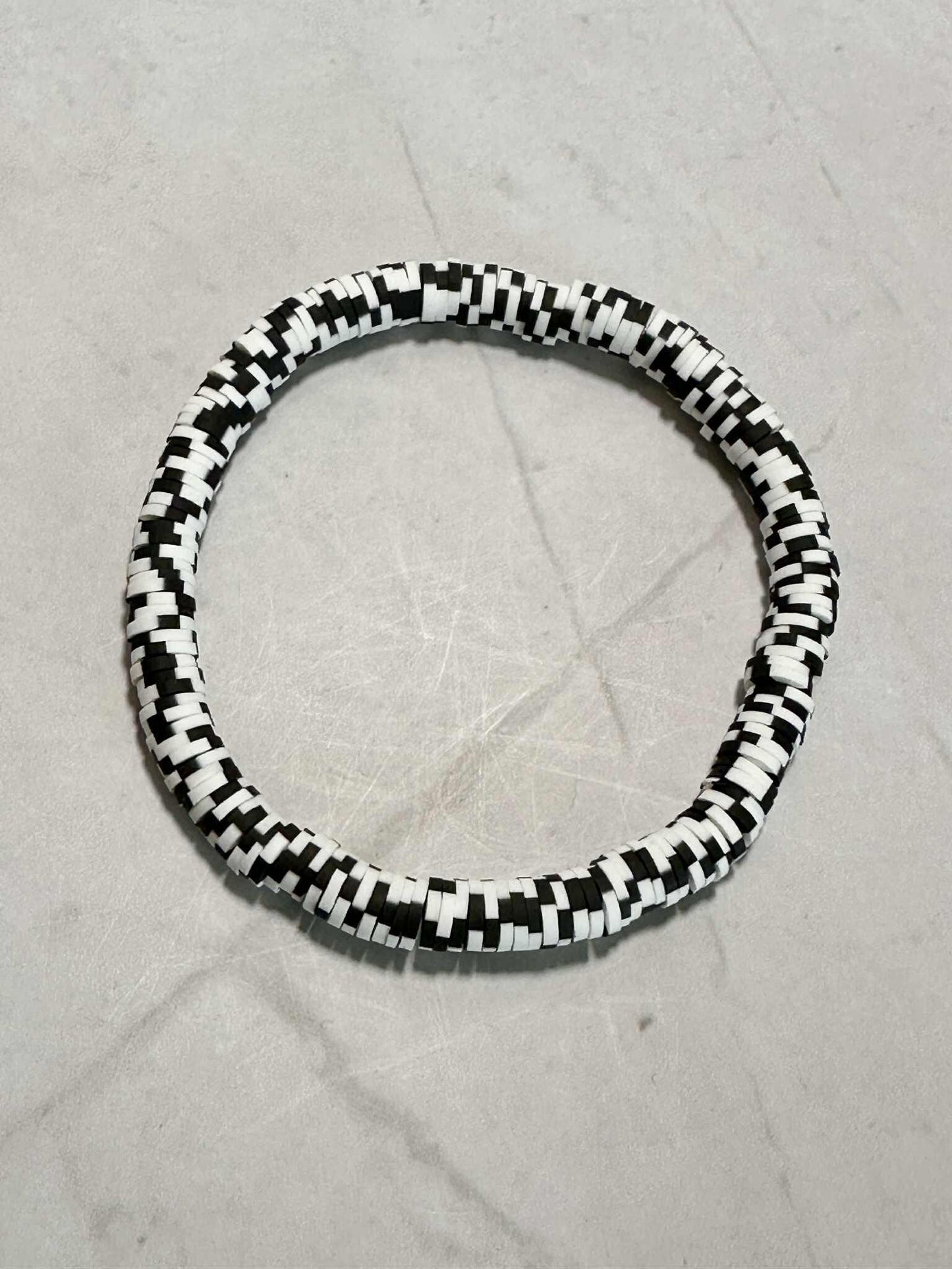Single Strand Raven Snow Heishi Clay Bead Bracelet