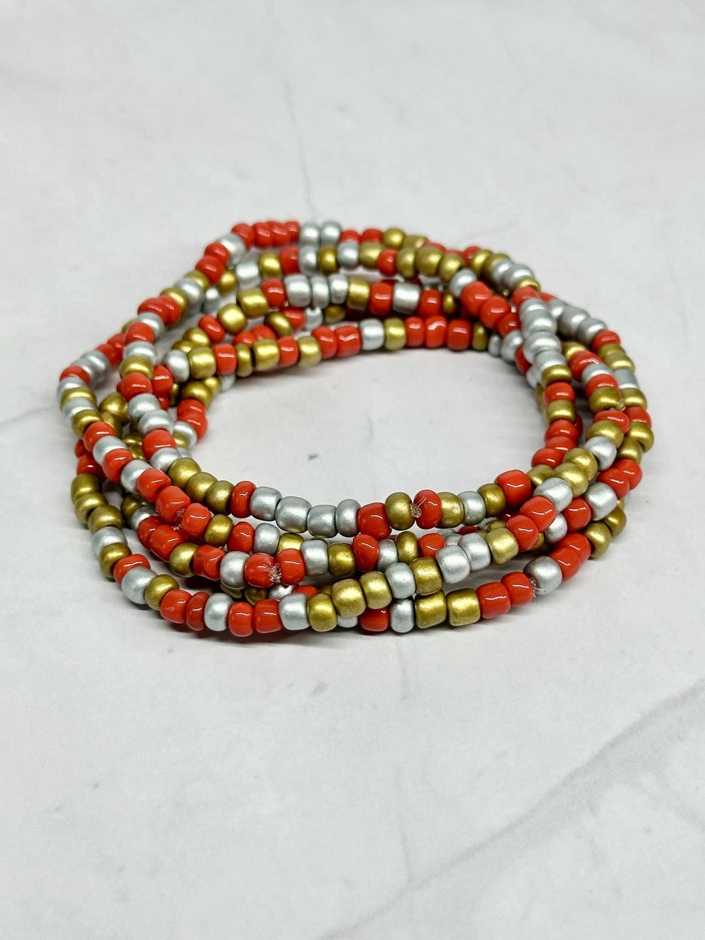 Single Strand Red, Silver, and Gold Seed Bead Stretch Bracelet