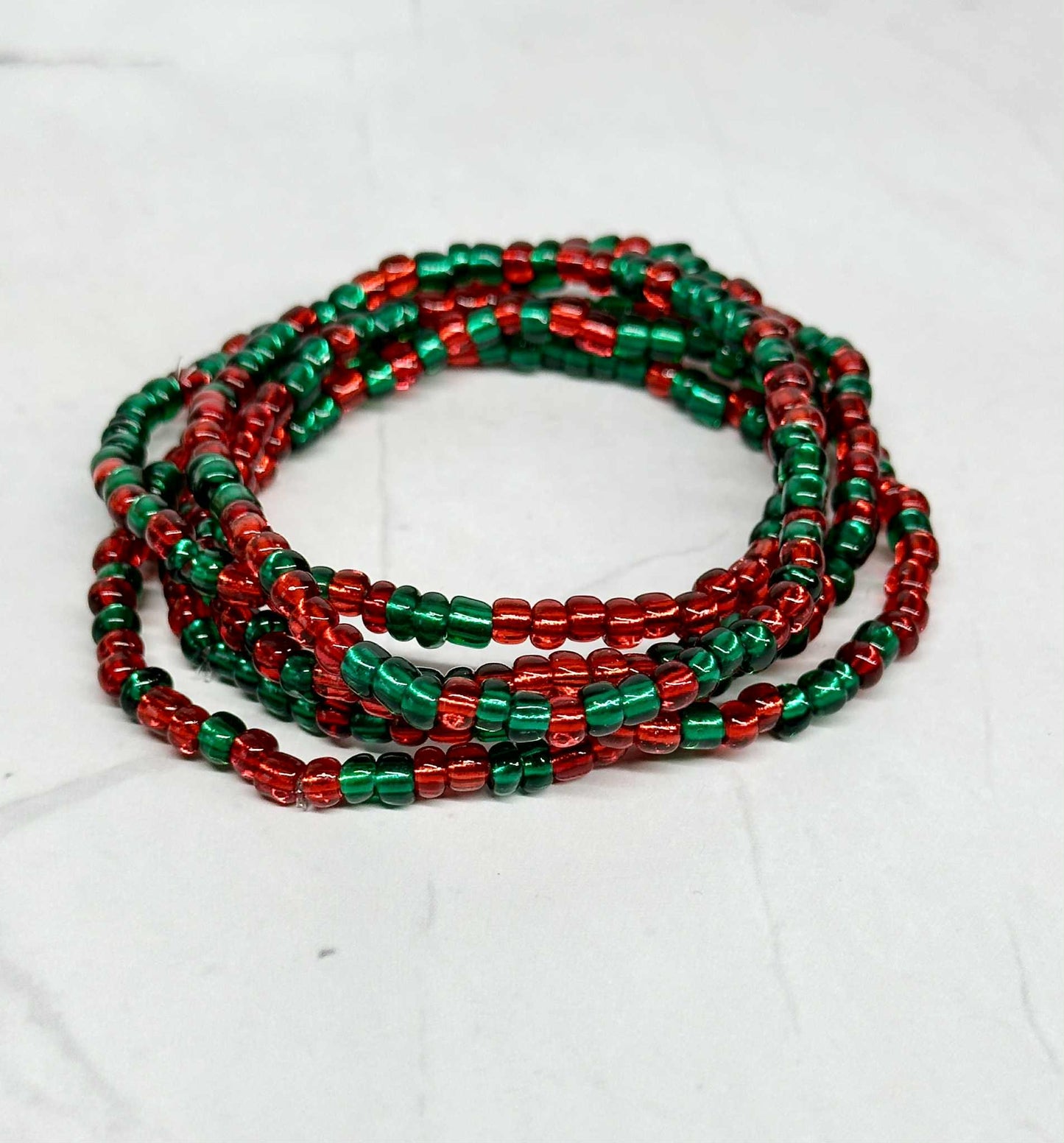Single Strand Red and Green Translucent Seed Bead Stretch Bracelet