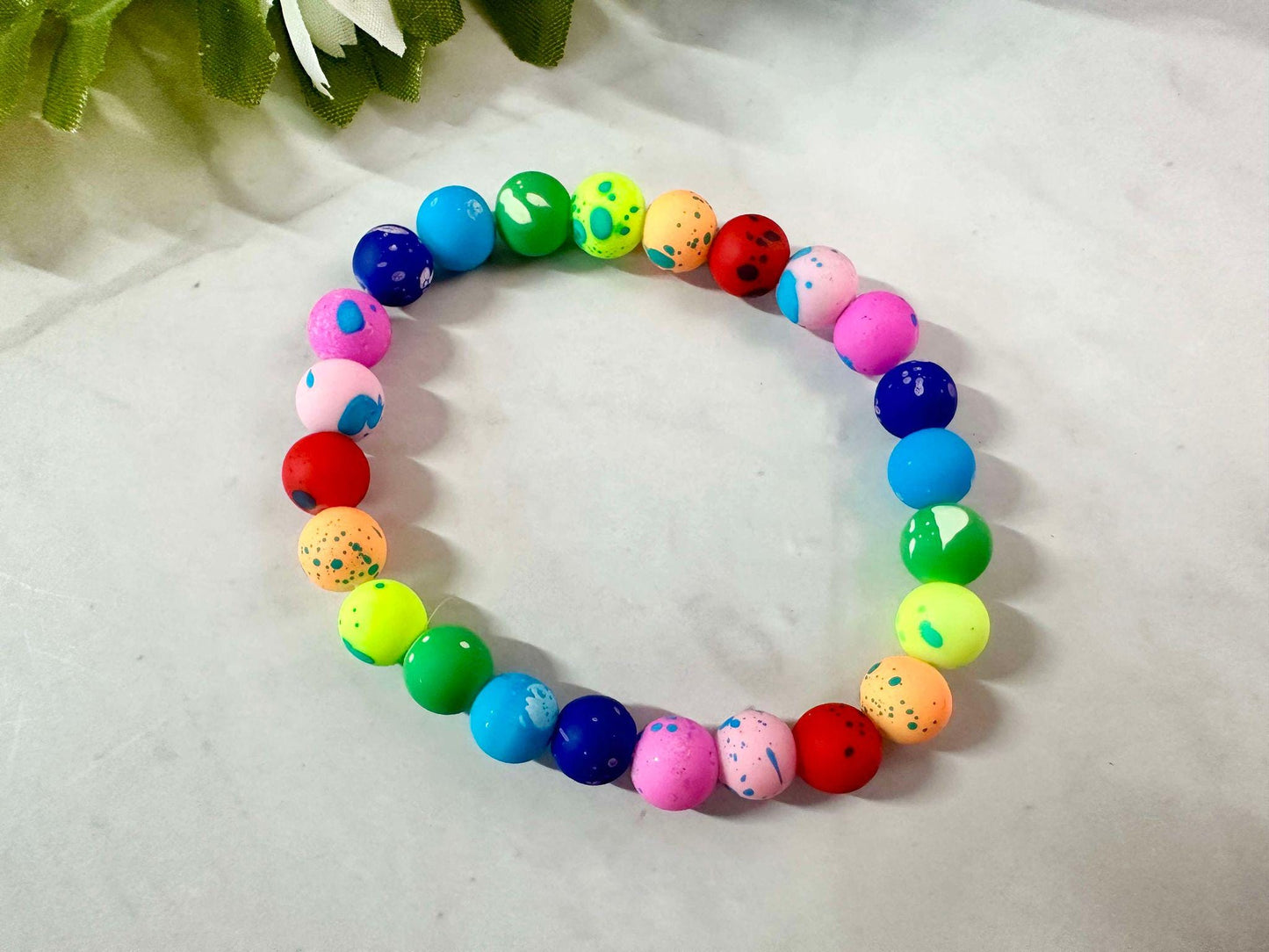 Single Strand Rainbow Splatter Rubber Bead Stretch Bracelet
