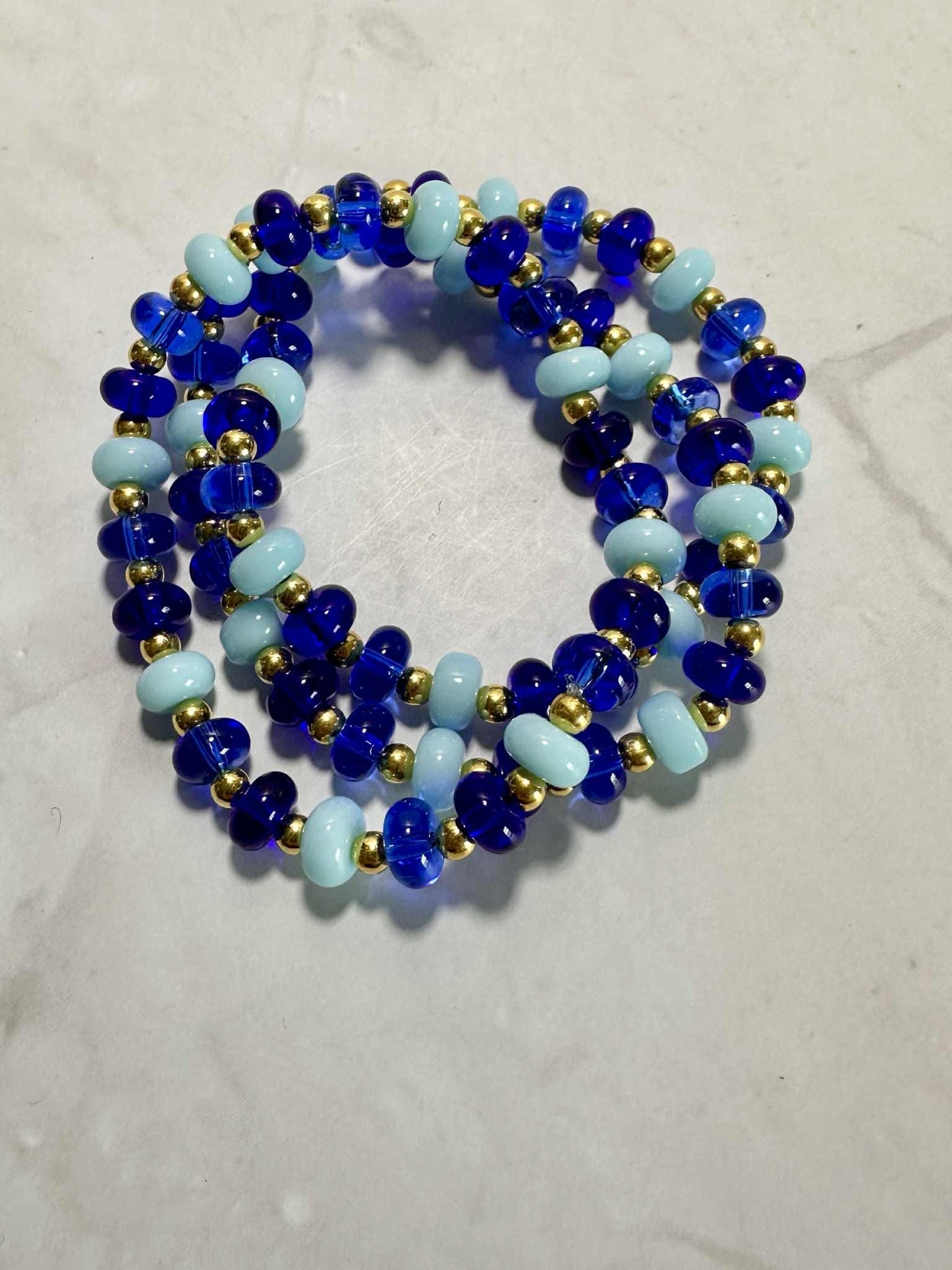 Single Strand Blue Ocean Glass Beaded Stretch Bracelet: Gold Accents