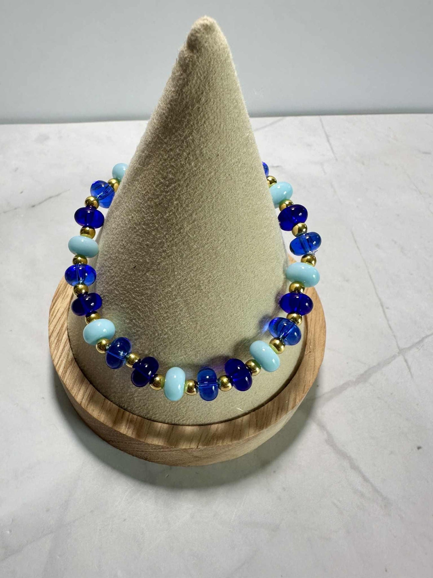 Single Strand Blue Ocean Glass Beaded Stretch Bracelet: Gold Accents