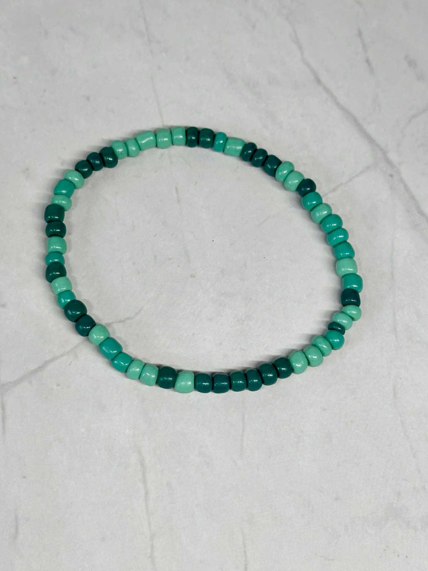 Single Strand Multi Green/Teal Seed Bead Stretch Bracelet