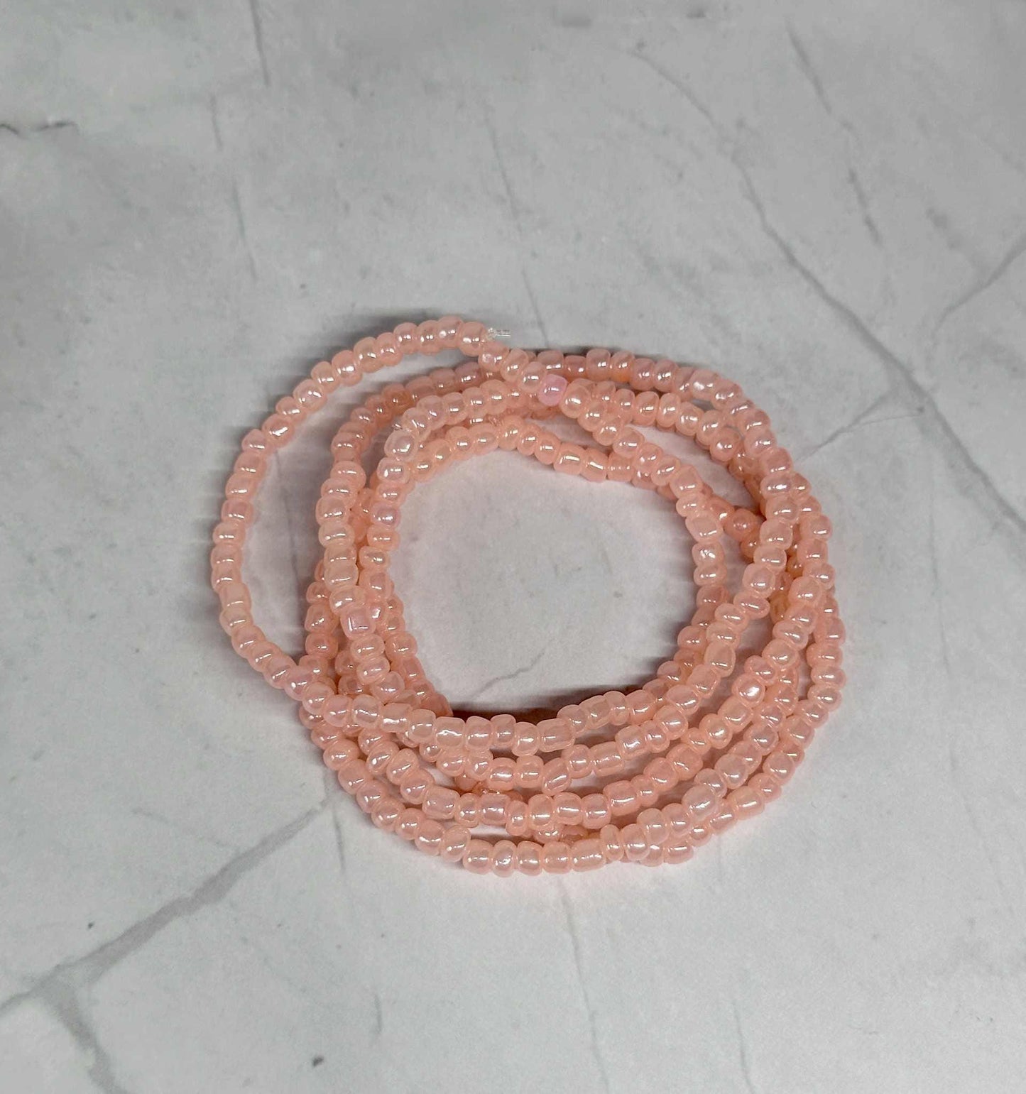 Single Strand Light Coral Seed Bead Stretch Bracelet