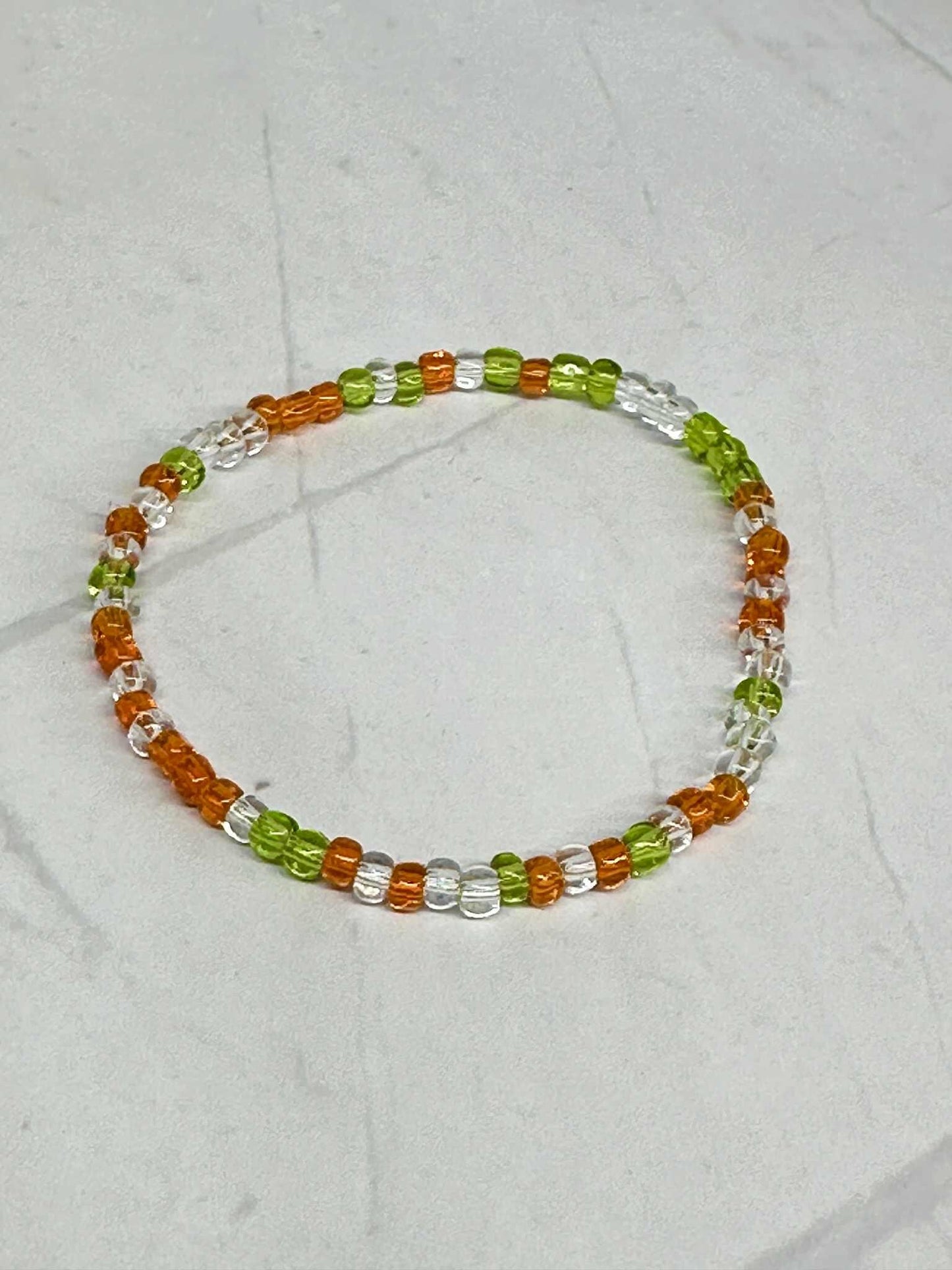 Single Strand Green, Orange, Translucent Glass Seed Bead Bracelet