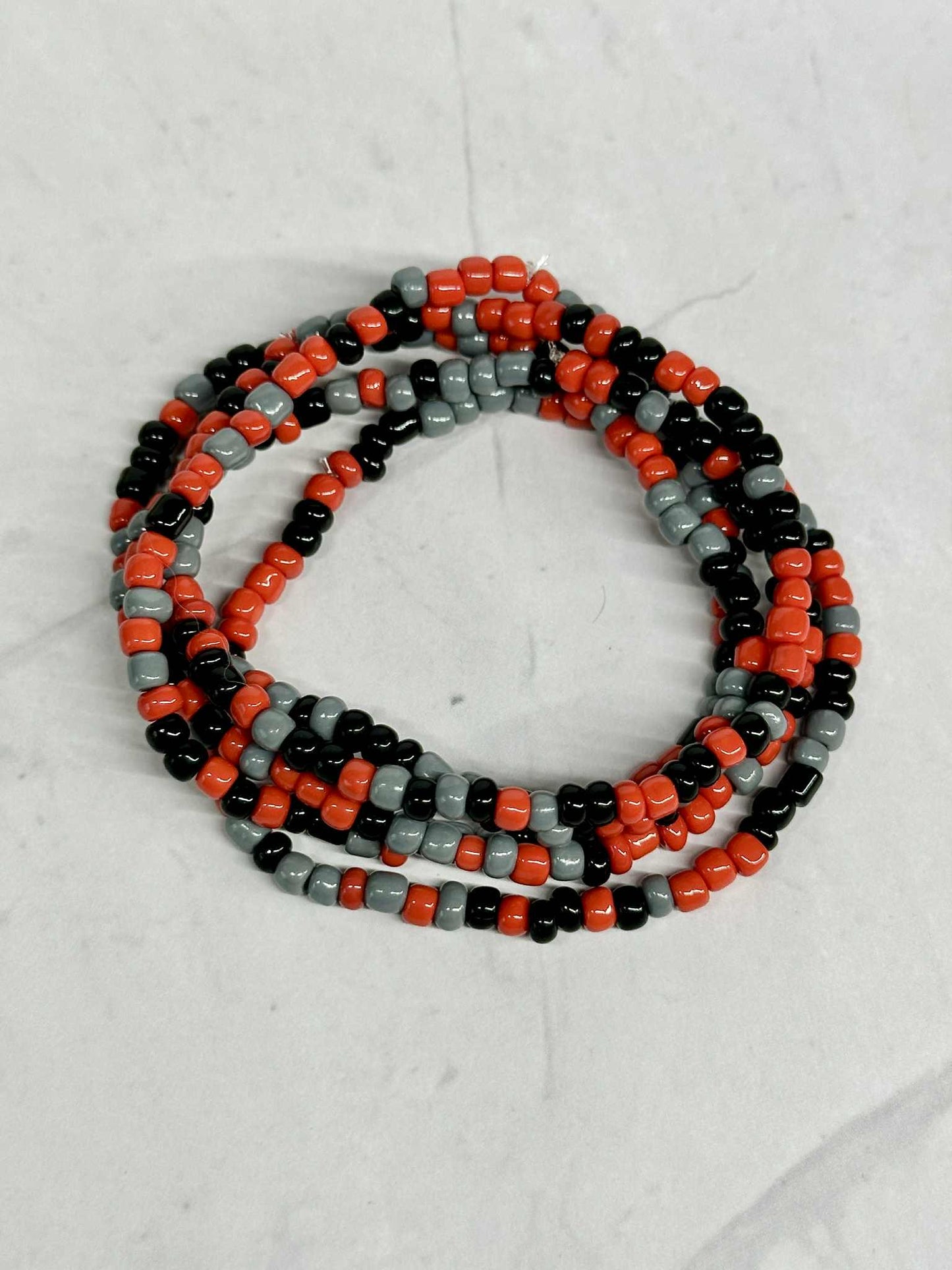 Single Strand Red, Black, and Gray Seed Bead Stretch Bracelet