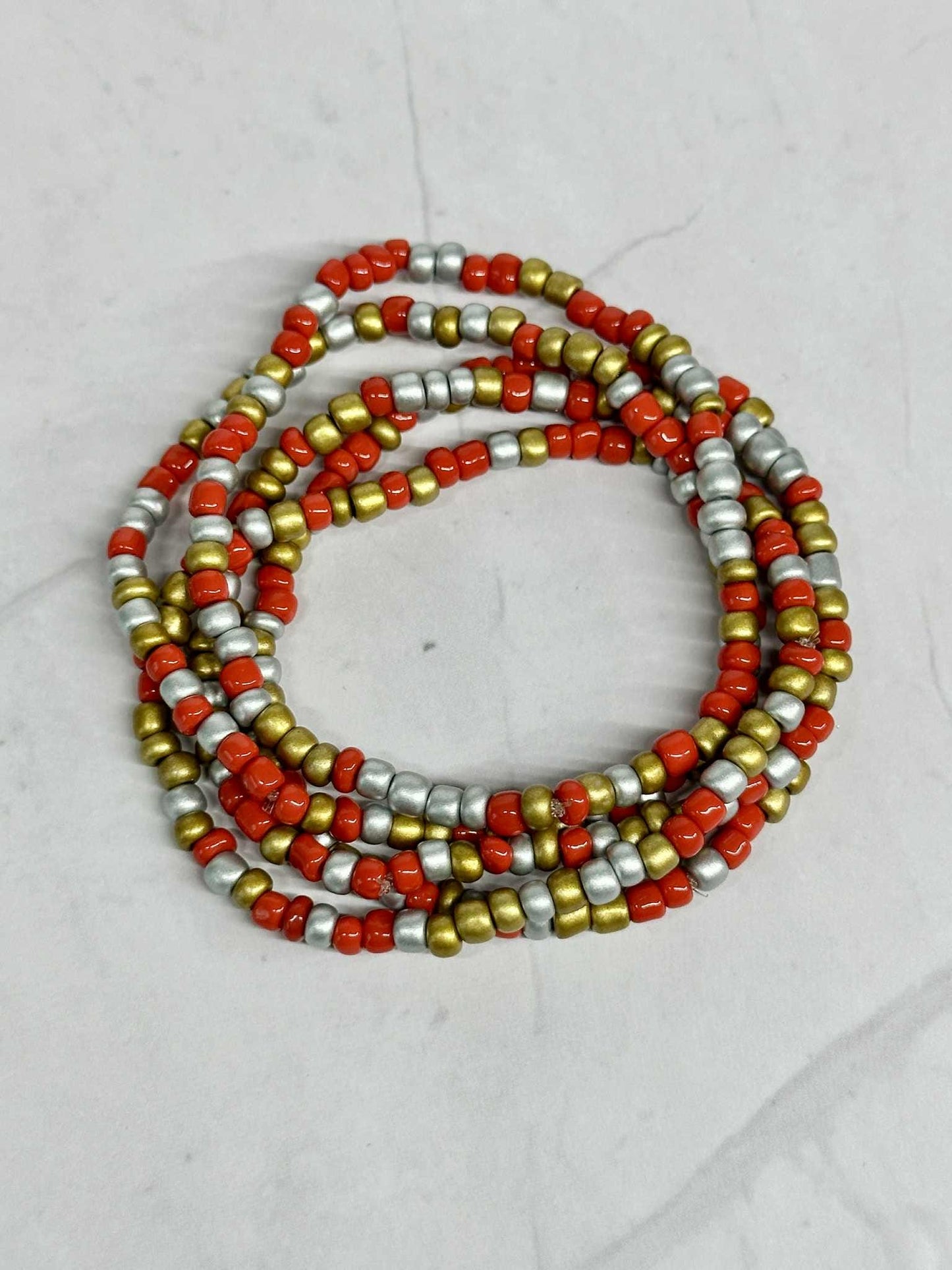 Single Strand Red, Silver, and Gold Seed Bead Stretch Bracelet