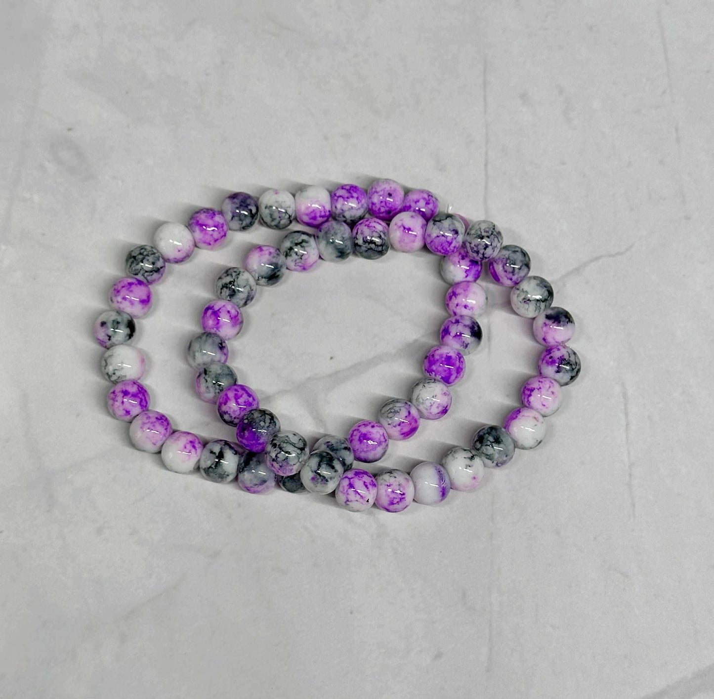 Purple, Black, and White Glass Beaded Stretch Bracelet