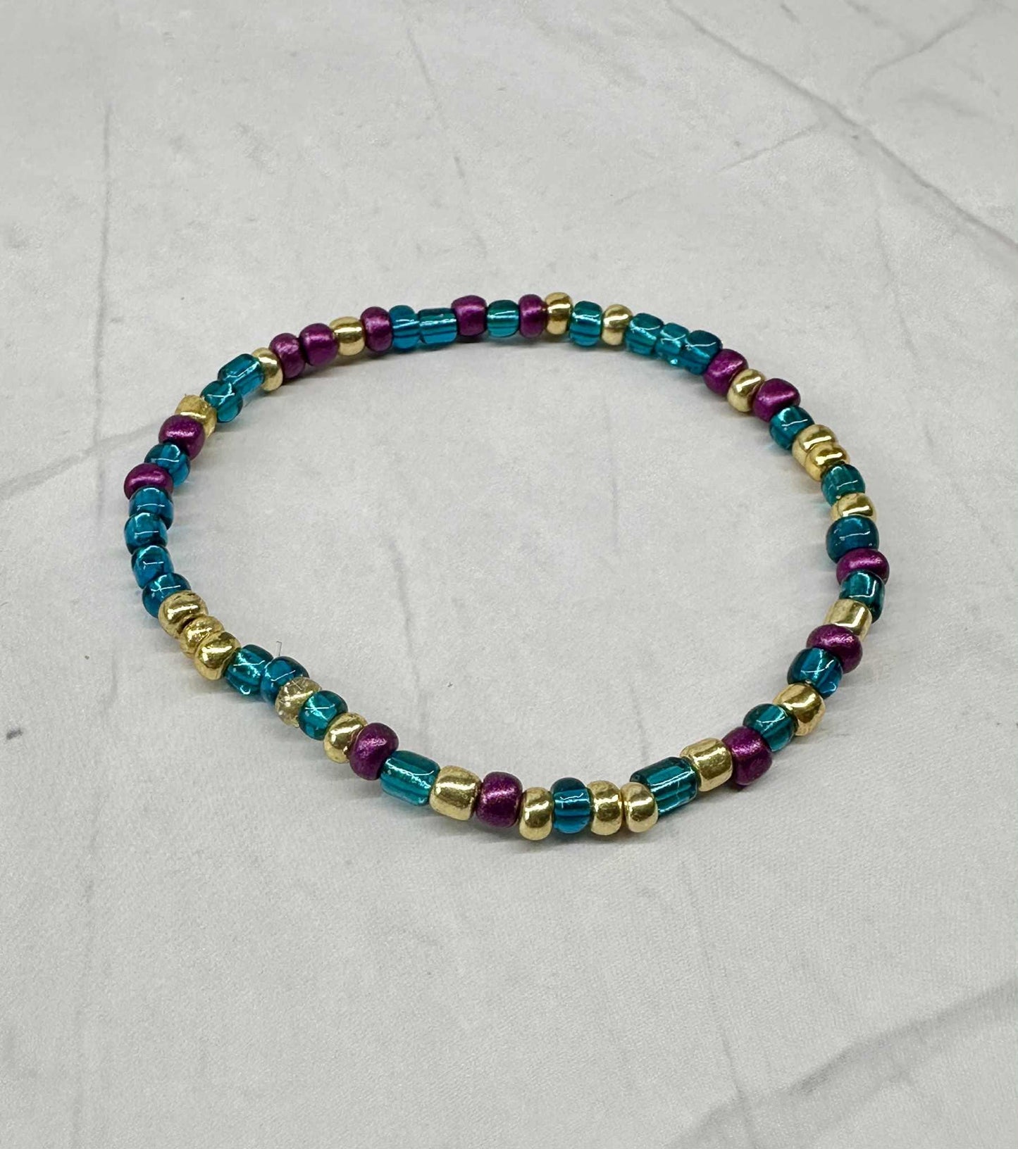 Single Strand Metallic Mardi Gras Seed Bead Bracelet