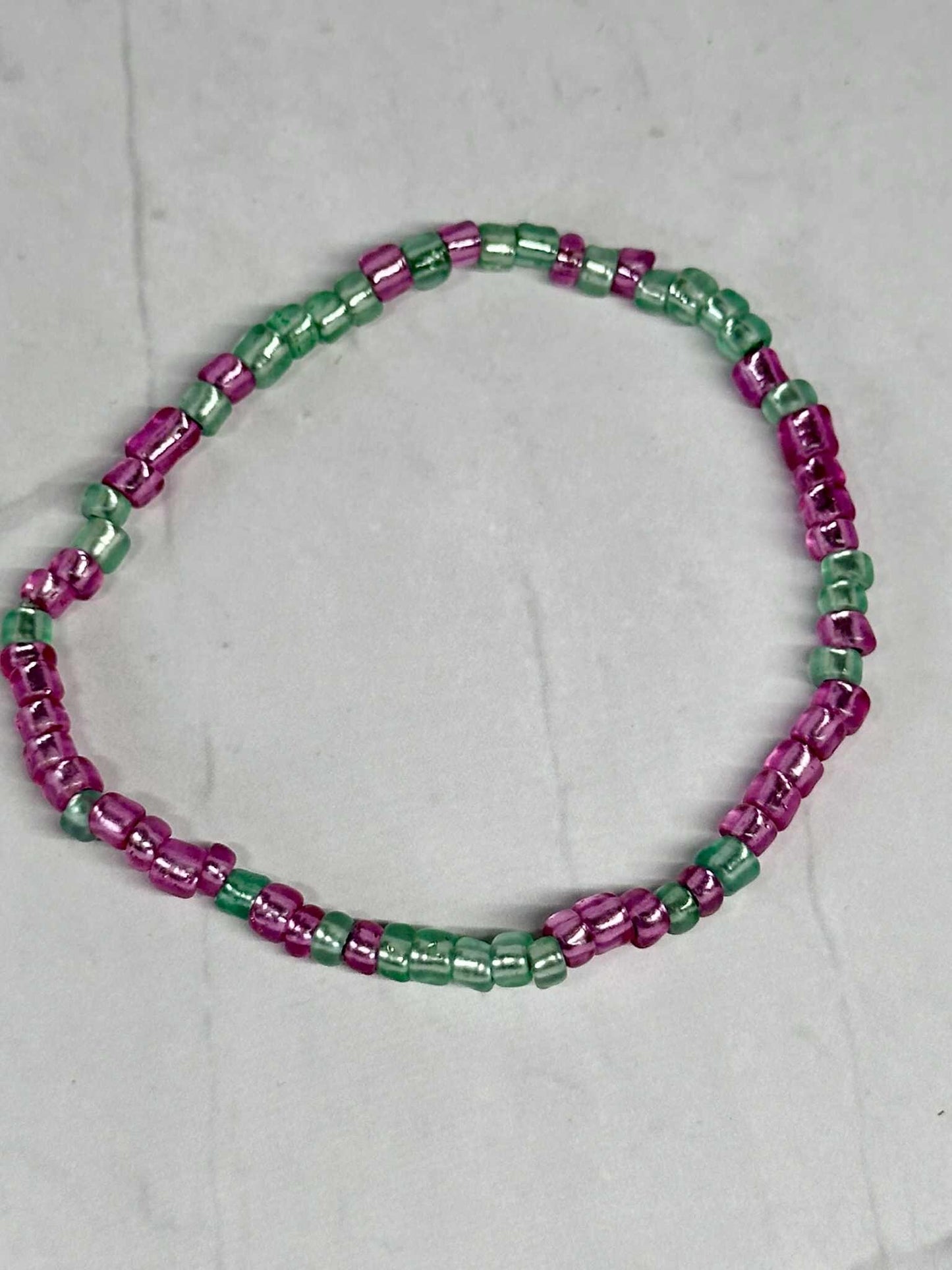 Single Strand Translucent Pink & Green Seed Bead Bracelet