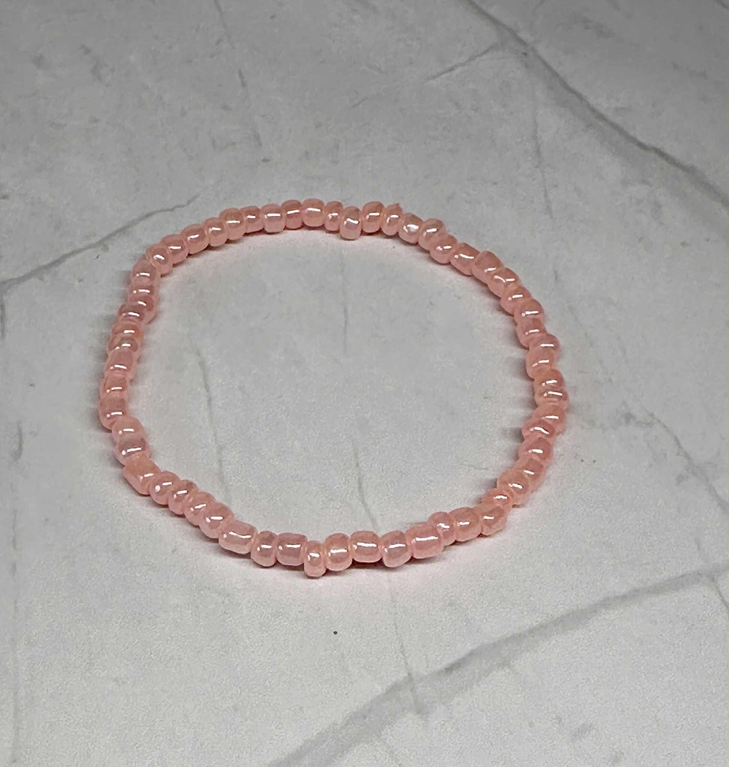 Single Strand Light Coral Seed Bead Stretch Bracelet