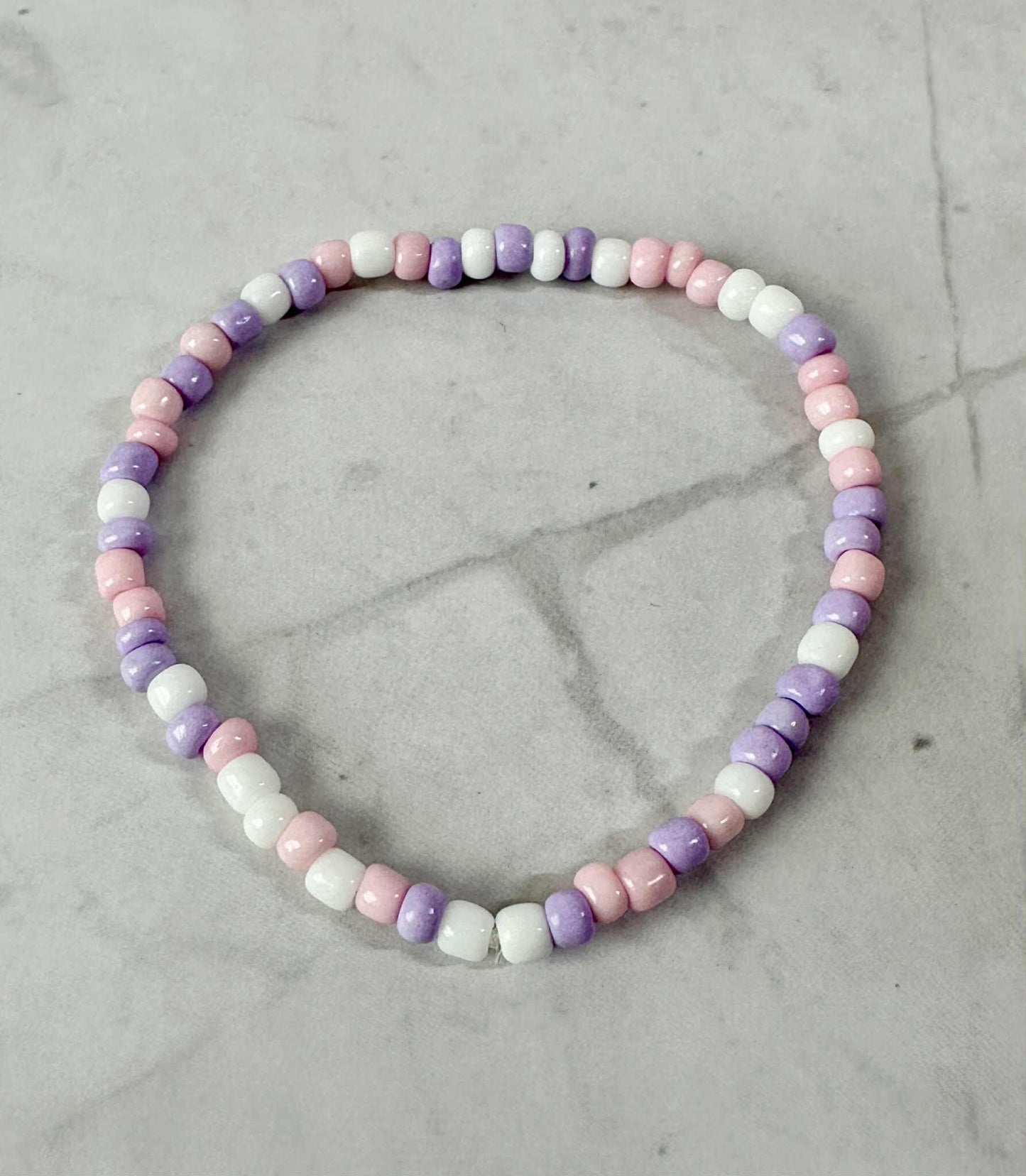 Single Strand Purple, Pink, White Seed Bead Stretch Bracelet