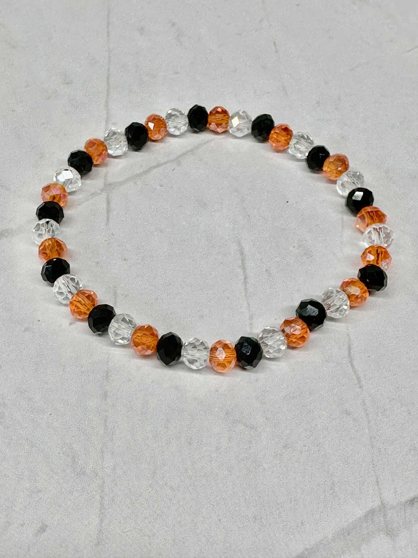 Single Strand Halloween Stretch Bracelet: Clear, Black & Orange Faceted Beads