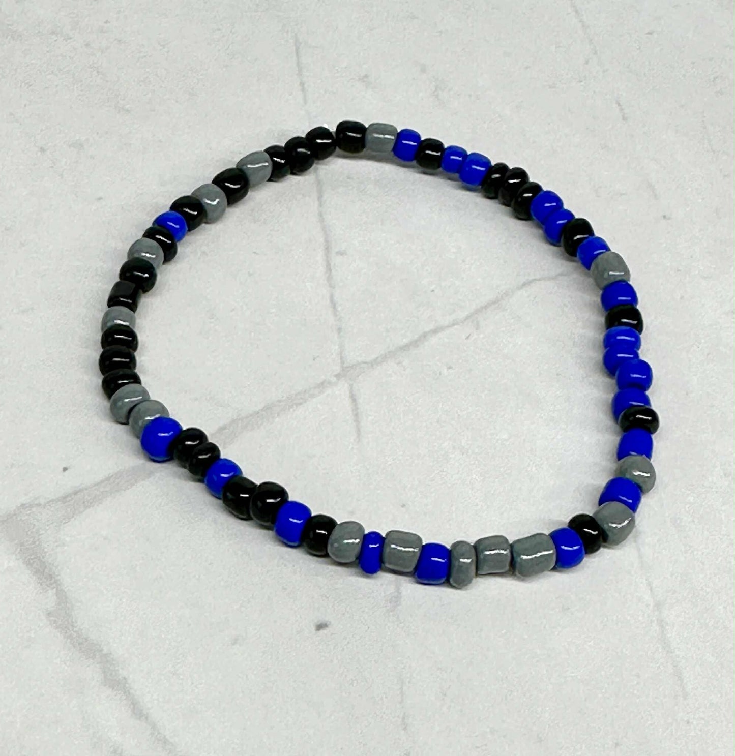 Single Strand Royal Blue, Black, and Gray Seed Bead Stretch Bracelet