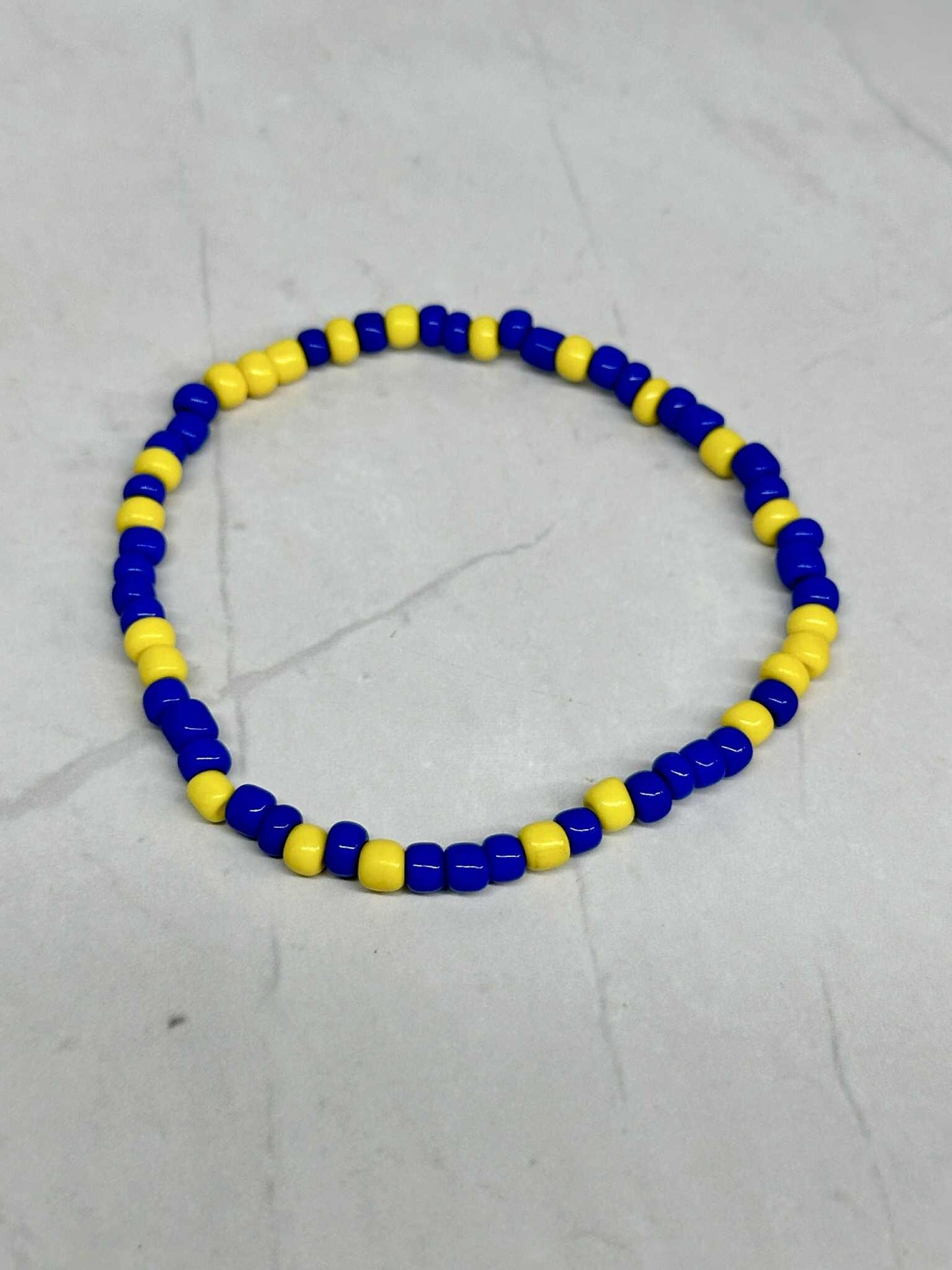 Single Strand Royal Blue and Yellow Seed Bead Stretch Bracelet