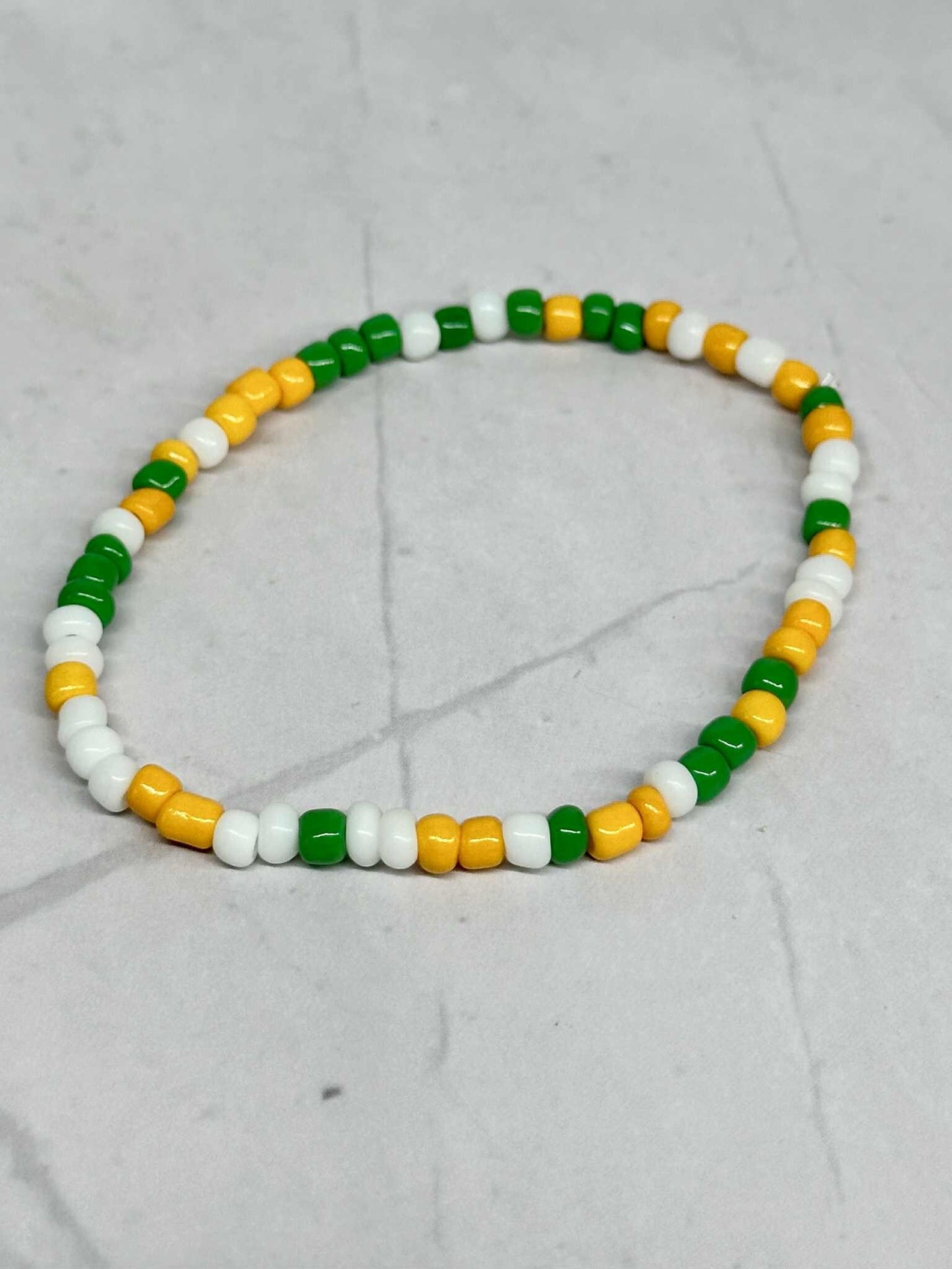 Single Strand Green, White, and Yellow Seed Bead Stretch Bracelet