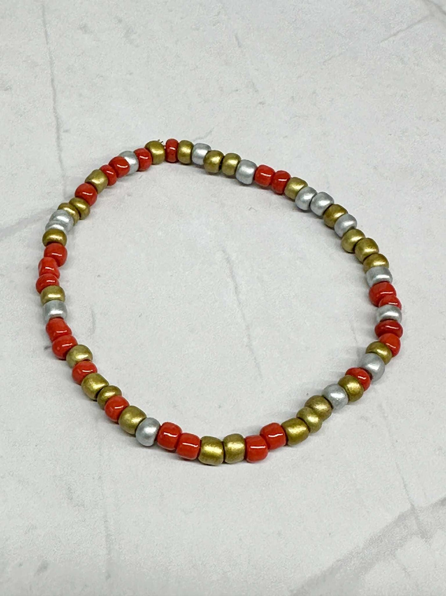 Single Strand Red, Silver, and Gold Seed Bead Stretch Bracelet
