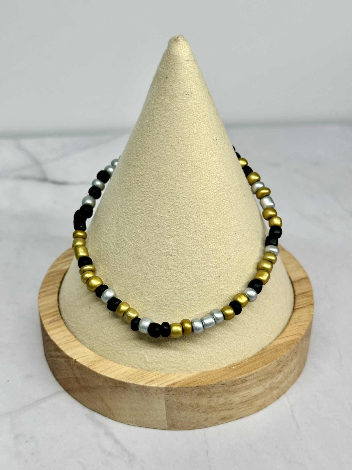 Single Strand Silver, Black, and Gold Seed Bead Stretch Bracelet