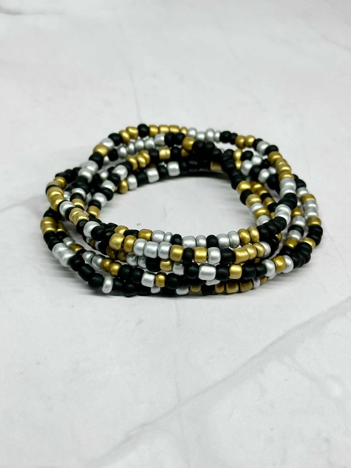 Single Strand Silver, Black, and Gold Seed Bead Stretch Bracelet