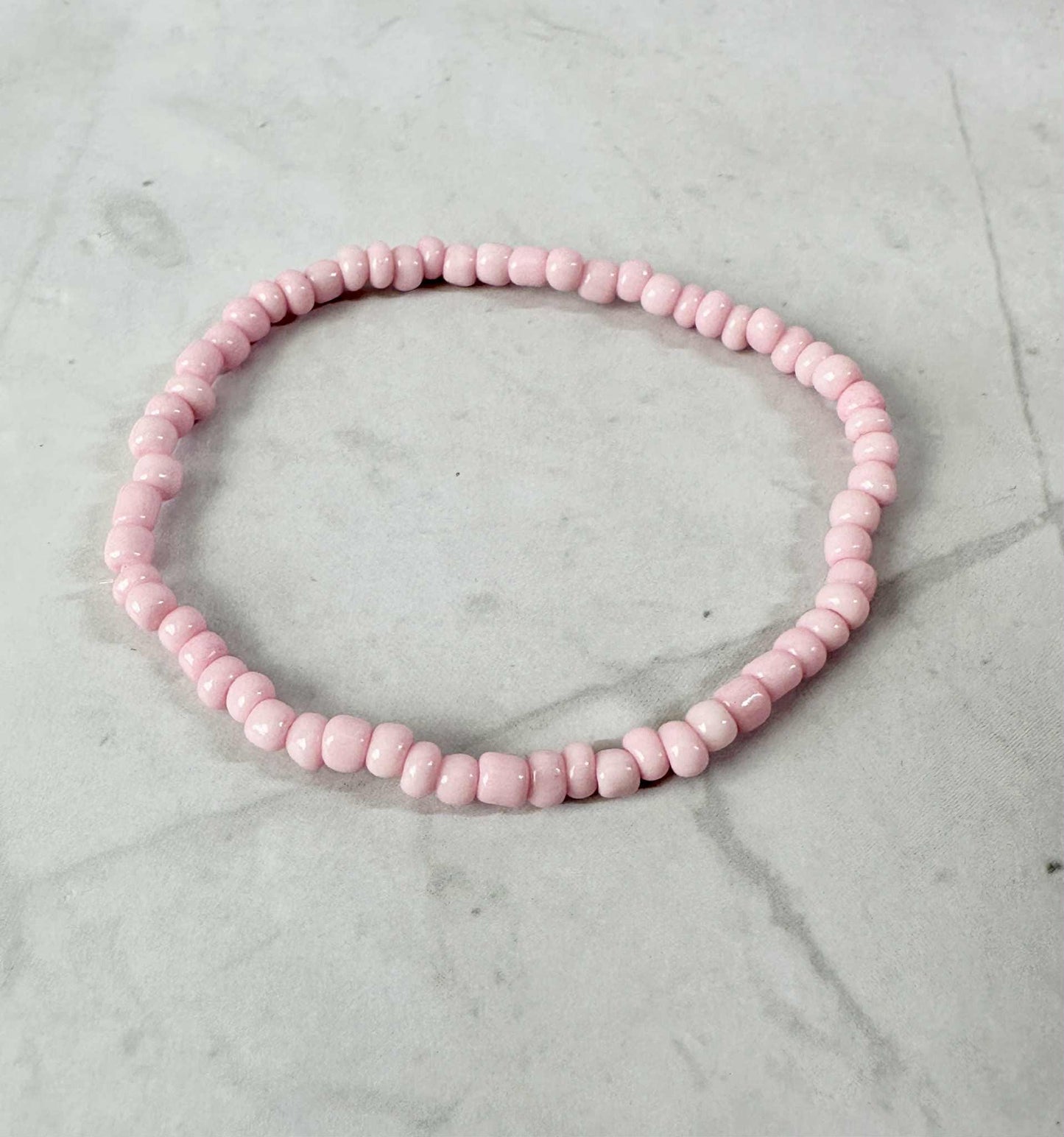 Single Strand Purple, Pink, White Seed Bead Stretch Bracelet