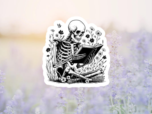Skeleton Sitting In Flowers Reading a Book Sticker