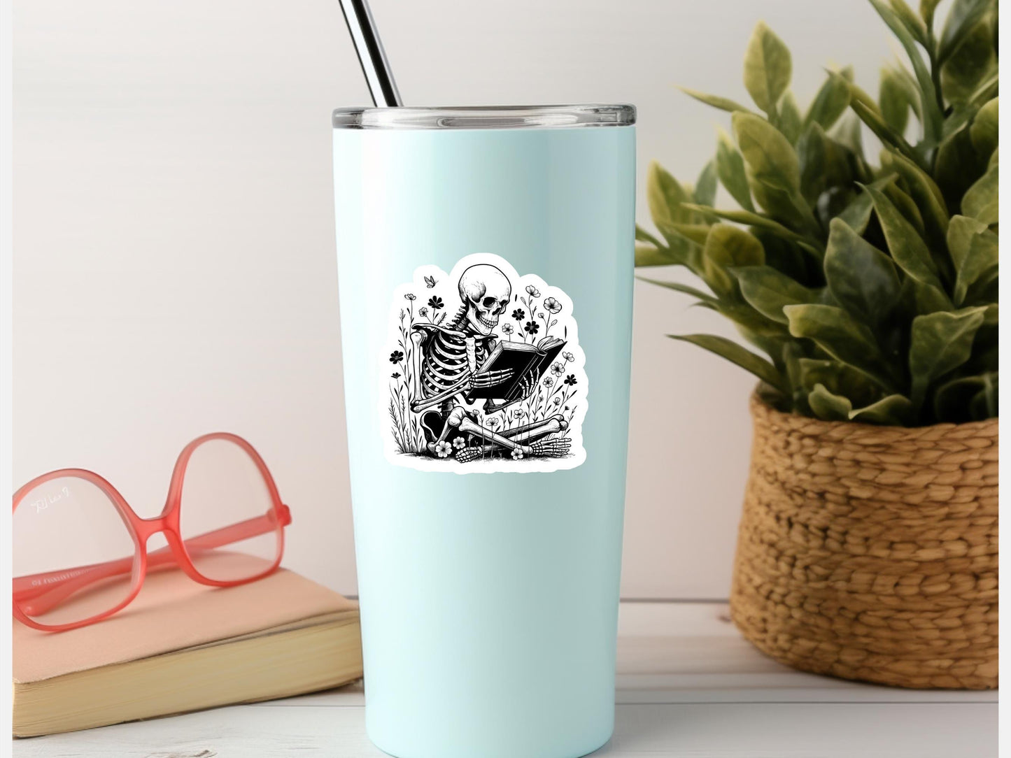 Skeleton Sitting In Flowers Reading a Book Sticker