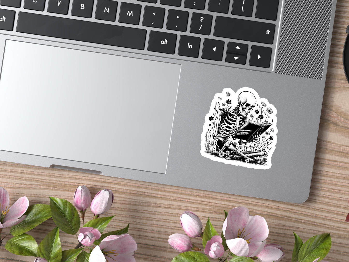 Skeleton Sitting In Flowers Reading a Book Sticker