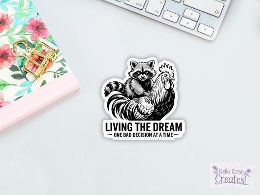 Living The Dream One Bad Decision At A Time Raccoon And Rooster Sticker