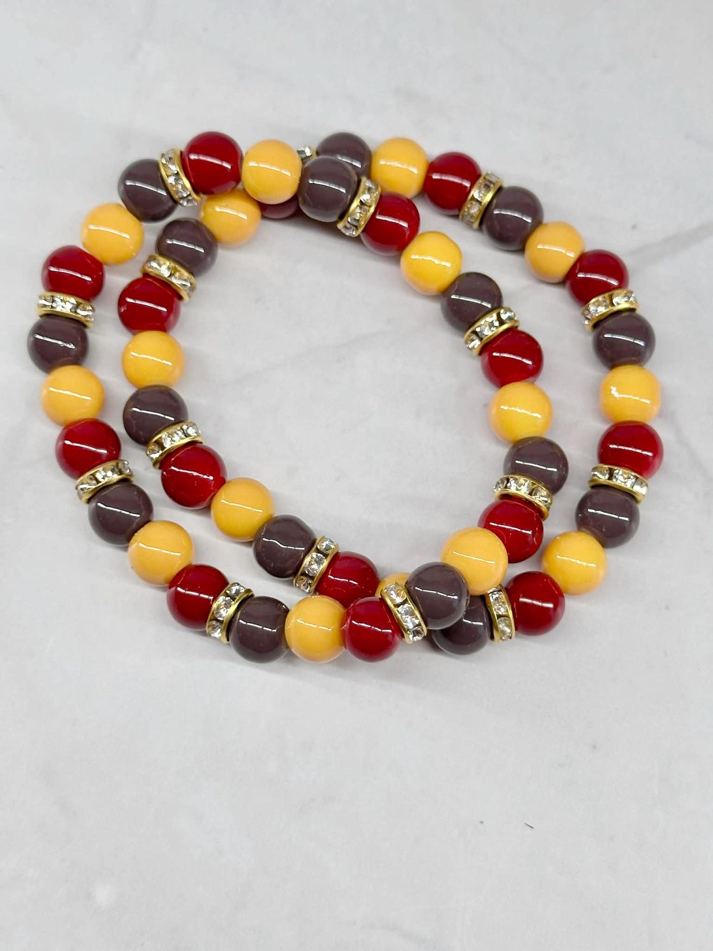 Single Strand Yellow, Red, and Brownish/Gray Beaded Stretch Bracelet