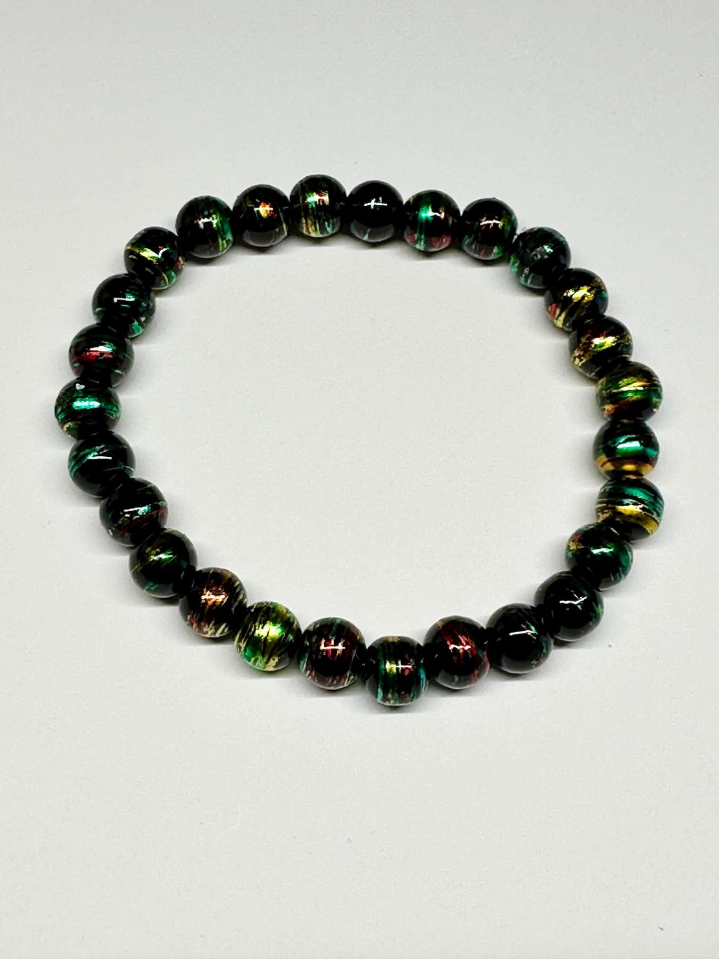 Single Strand Black, Green, Red, Gold Mixture Beaded Stretch Bracelet