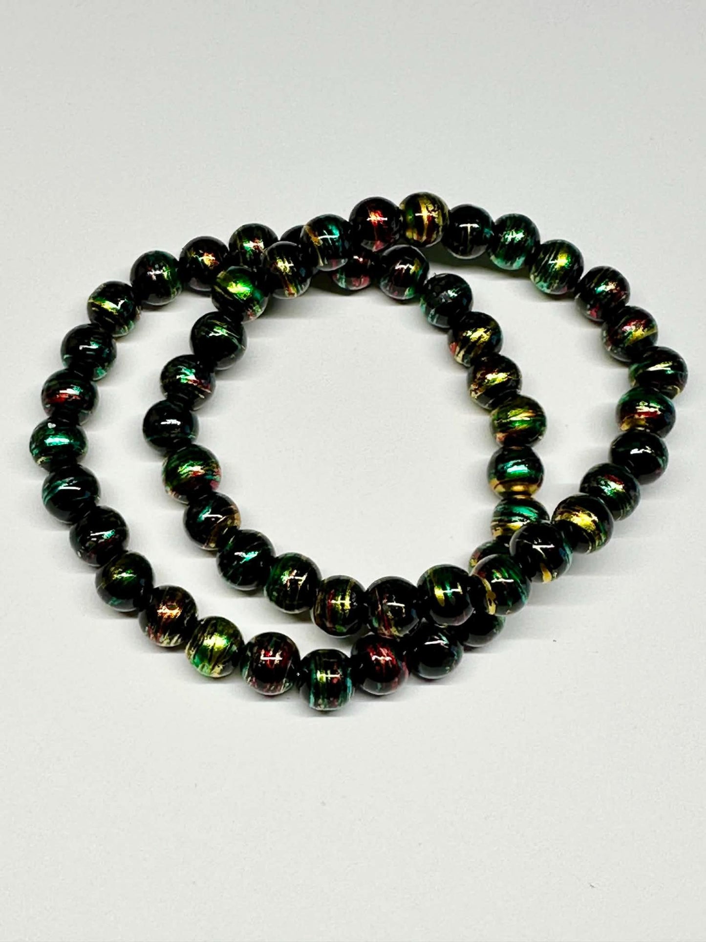 Single Strand Black, Green, Red, Gold Mixture Beaded Stretch Bracelet